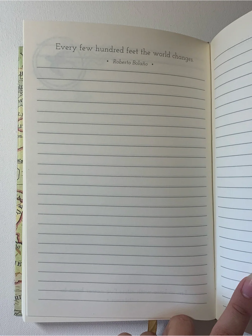 Travel Journal with map design and quote from J.R.R. Tolkien